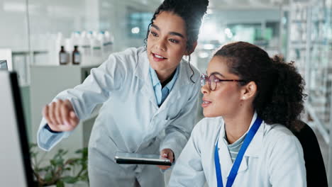 two scientists celebrate a breakthrough in the lab