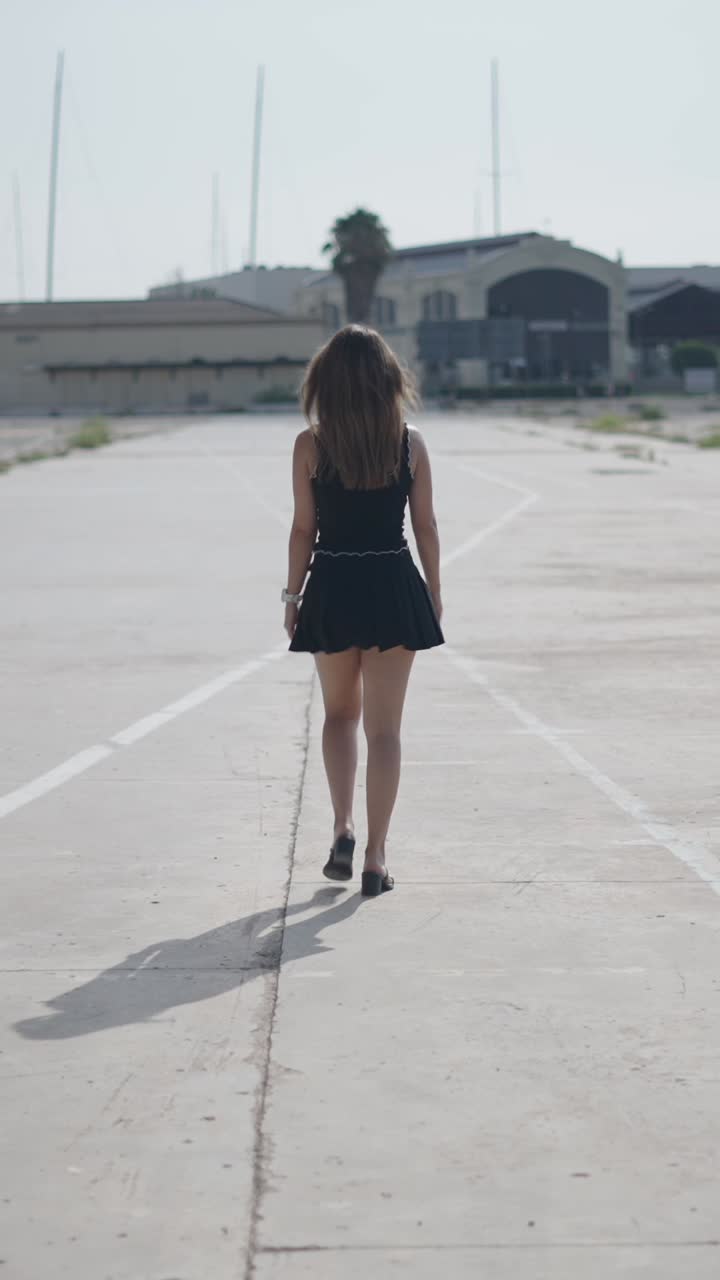 Woman Walking on Concrete