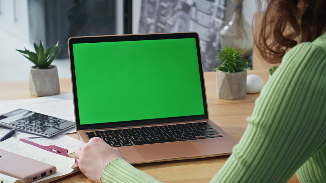 Woman touching touchpad mockup laptop turning on online application home closeup