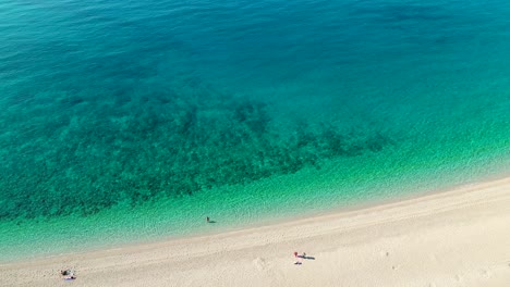 white-sand-and-blue-water-of-the-mediterranean-sea-from-above