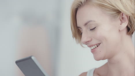beautiful young woman using digital tablet in lifestyle home