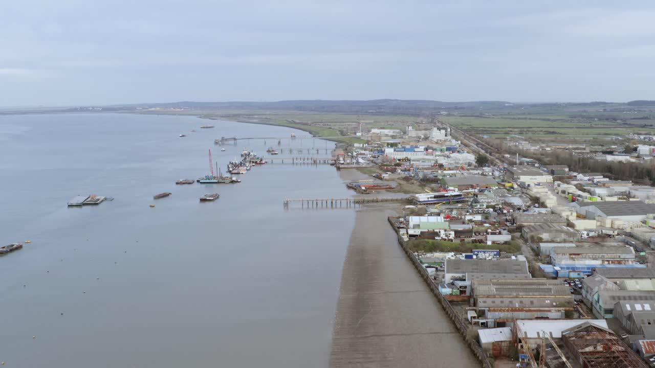 Overhead drone approach shows boats clustered on River Thames near Gravesend harbor