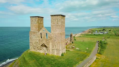 a beautiful drone aerial over the reculver towers an abandoned abbey in kent england