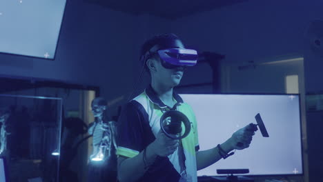 tech-savvy man wearing metaverse virtual reality headset with hand controllers