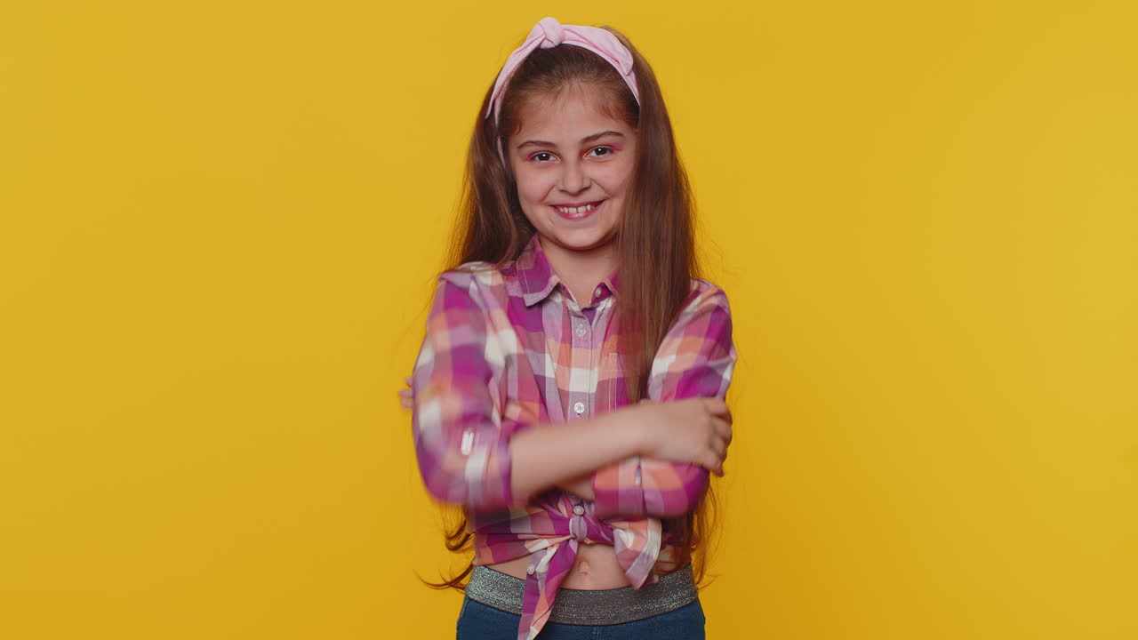 Happy preteen child girl kid showing victory sign, hoping for success and win, doing peace gesture