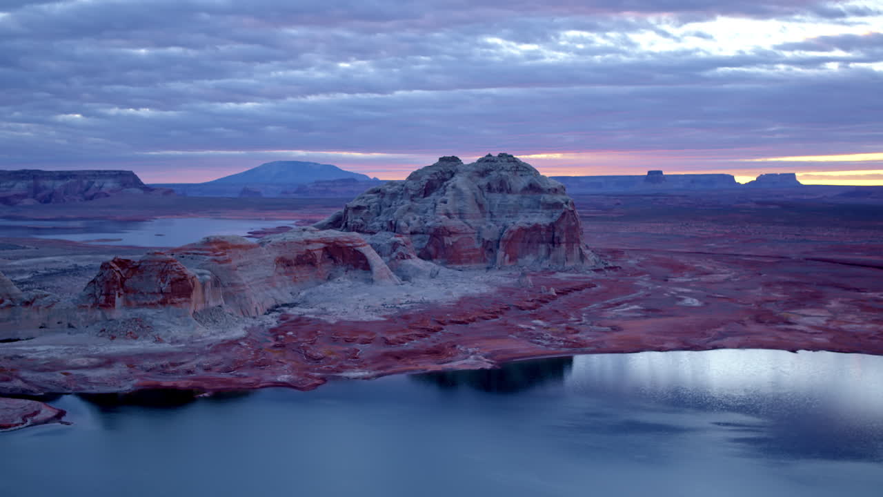 The camera elegantly maneuvers through Glen Canyon, revealing the delicate details of its wind-carved formations.