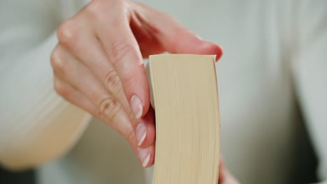 close-up of a woman reading a book