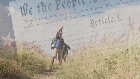 animation of american flag over diverse couple hiking in mountains