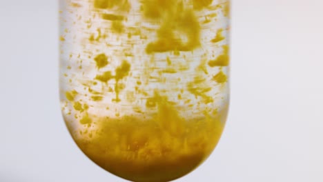 yellow precipitate forms in clear liquid solution