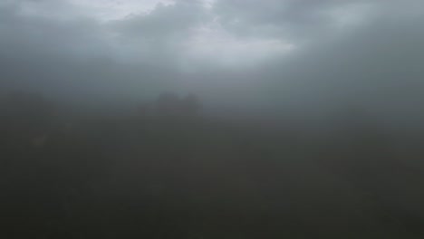 misty fog over costa rica jungle on bleak overcast day, 4k drone