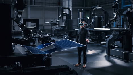 engineer in vr headset overseeing robotic solar panel manufacturing