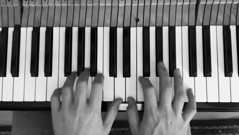 pianist hands playing on piano