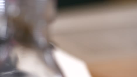 slider shot of defocused hand turning page in a book