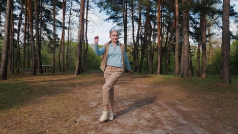 woman dancing in a forest park