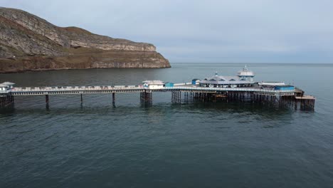 llandudno pier welsh victorian boardwalk resort promenade aerial view wide orbit to front