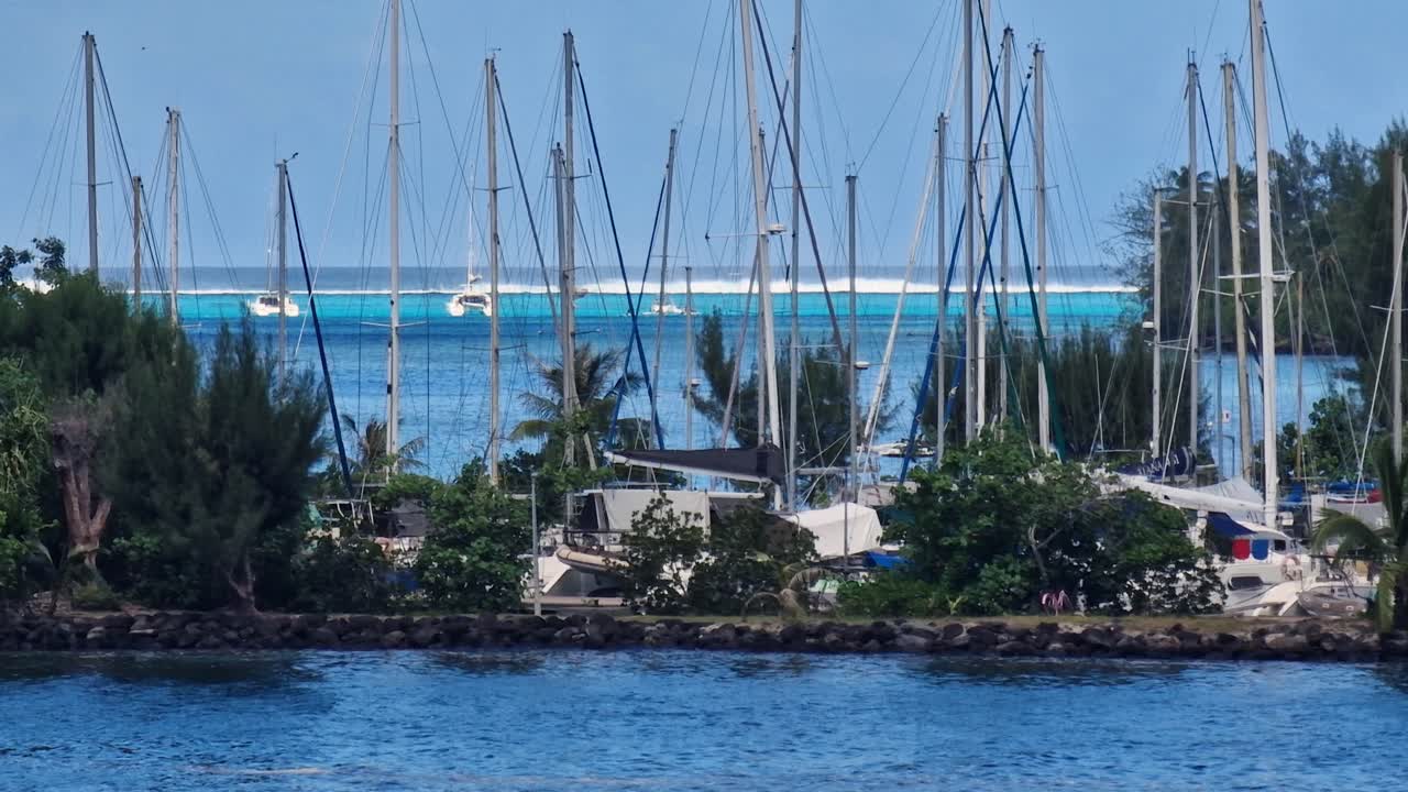 Moorea Island, French Polynesia. Sailboats in Boat Harbor With Lagoon in Background