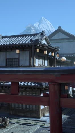 japanese village with snow-covered mountain