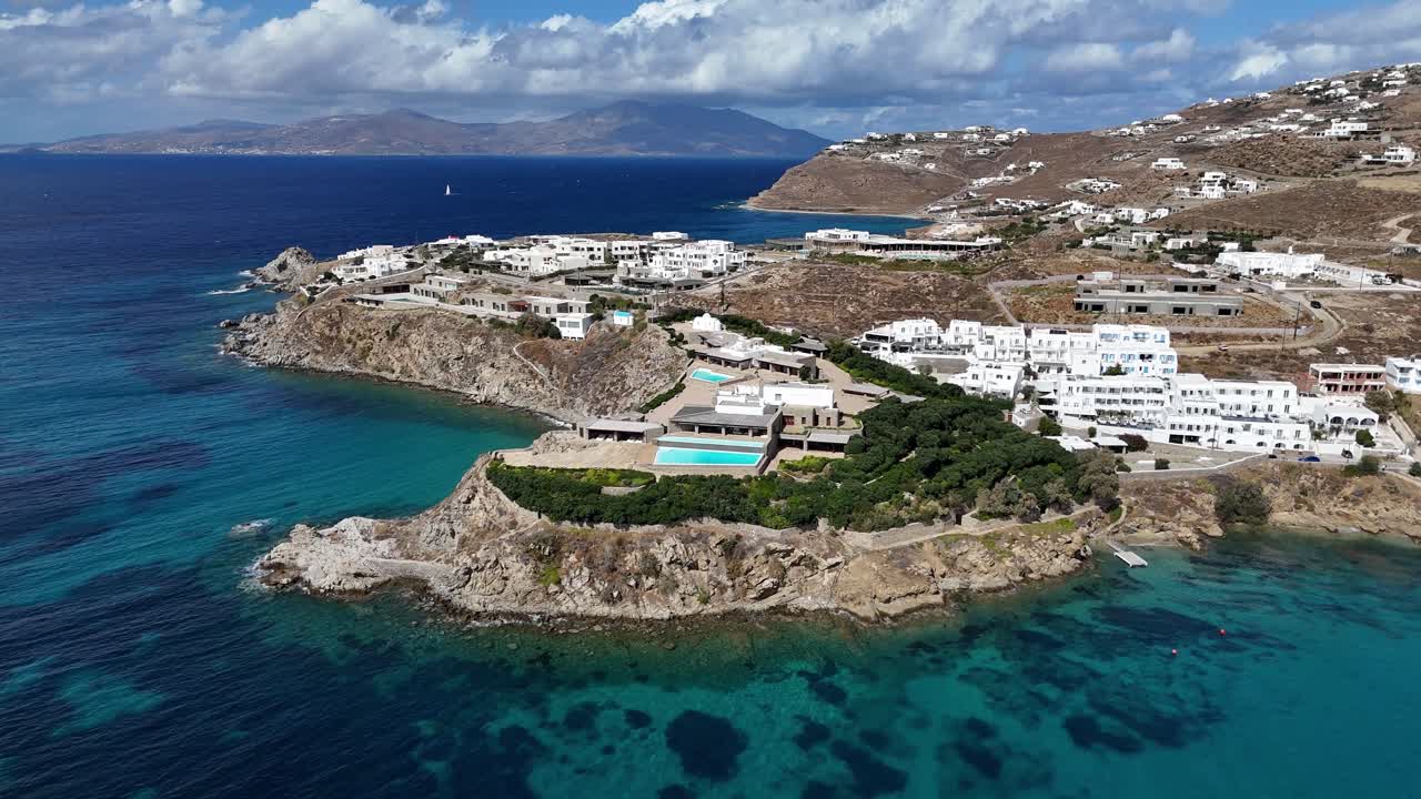 sunny clear blue coastal enclave of Mykonos, Greece, home of the rich and famous