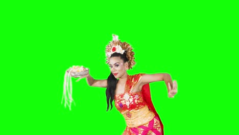 female balinese dancer performing pendet dance