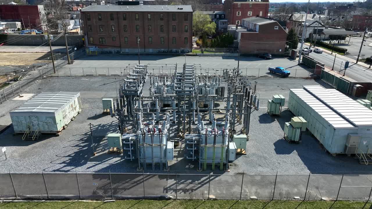 Establishing aerial shot of transformer for energy in city