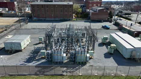 establishing aerial shot of transformer for energy in city