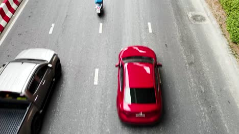 overhead shot of traffic in bangkok on a busy road with vehicles
