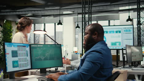 vertical video workplace support employee moves a delivery cart stacked with folders
