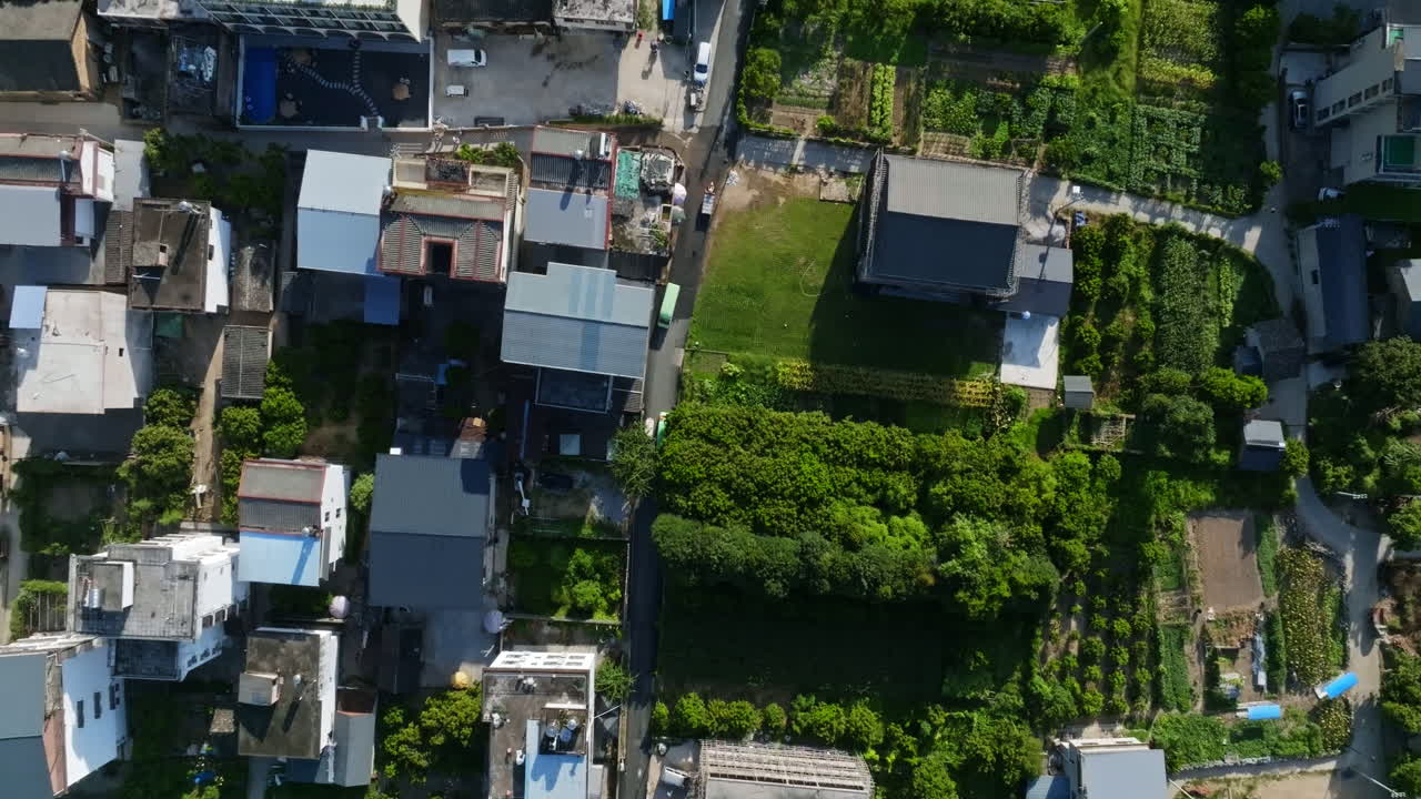 Aerial view of a town with buildings and greenery