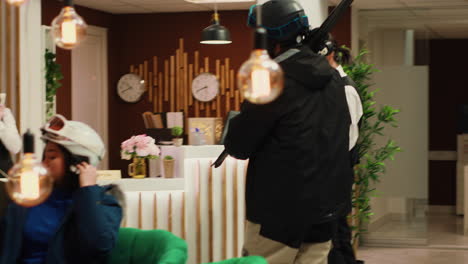 Hotel-staff-greeting-tourist-in-lobby