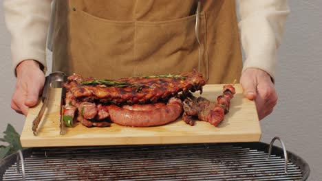 traditional spanish barbeque, big sausage chorizo botifarra, pork and beef ribs on grill with fire, american style cooking, chef grilling meat fat food, steaks and sausages on bbq. high quality 4k footage