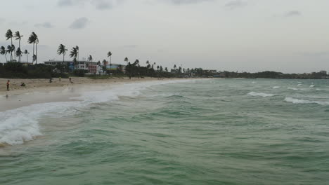 waves rushing ashore of coco beach in dar es salaam , tanzania