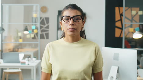 time lapse of hispanic businesswoman posing in office