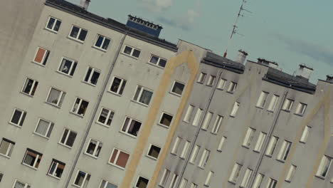 multi-story apartment buildings with numerous windows