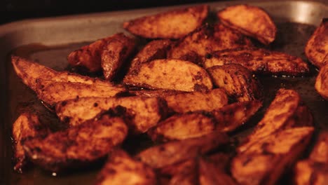 spicy paprika potato wedges freshly cooked on baking tray