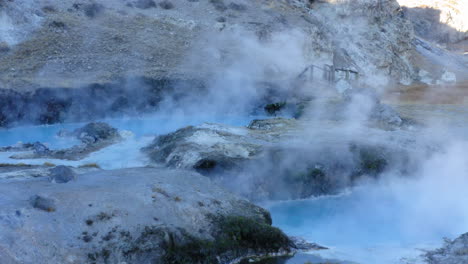 famous steaming hot spring, hot creek geological site, travel destination, aerial flyover