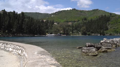 view from kouloura harbour to the picturesque bay and beach on corfu