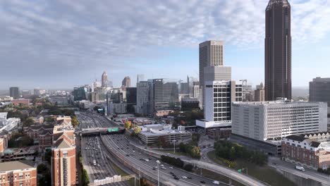 aerial push up atlanta georgia skyline an traffic on freeway