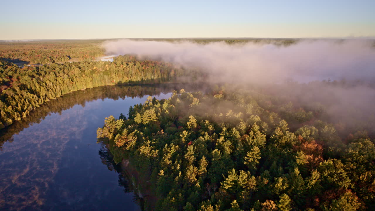 Aerial shot of water releasing mist into the morning air