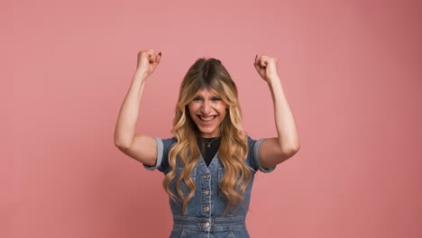 excited transgender woman with clenched fists celebrating victory