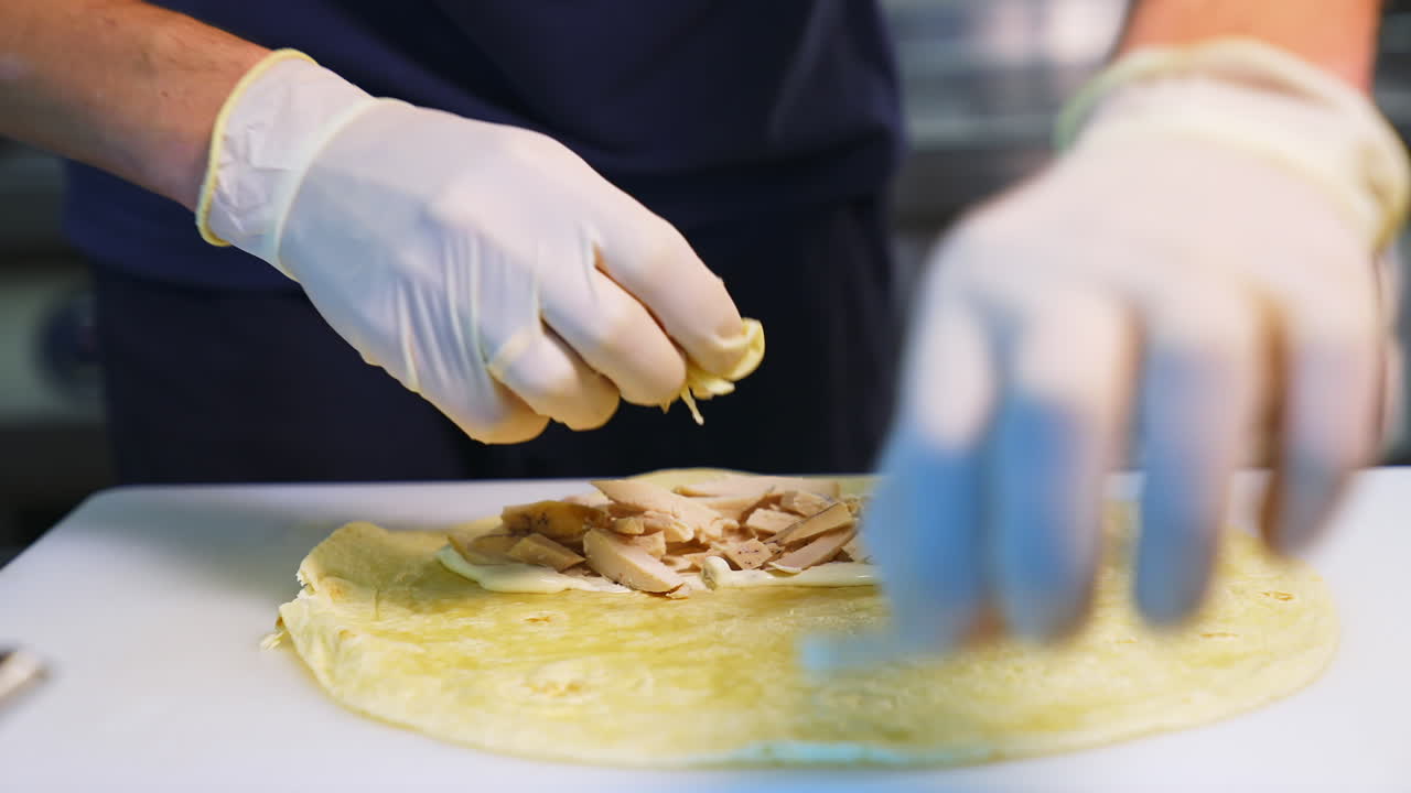 Chef cooking shawarma kebab. Chef preparing and making traditional shawarma