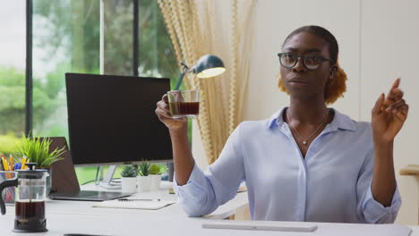 woman working from home office at desk interacting with ar technology