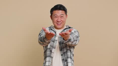 Asian man opening hands free gifts presents for you charity donation sharing love surprise award
