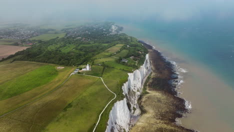 white cliffs of dover, coastline and south foreland lighthouse in kent, england, uk. - aerial shot