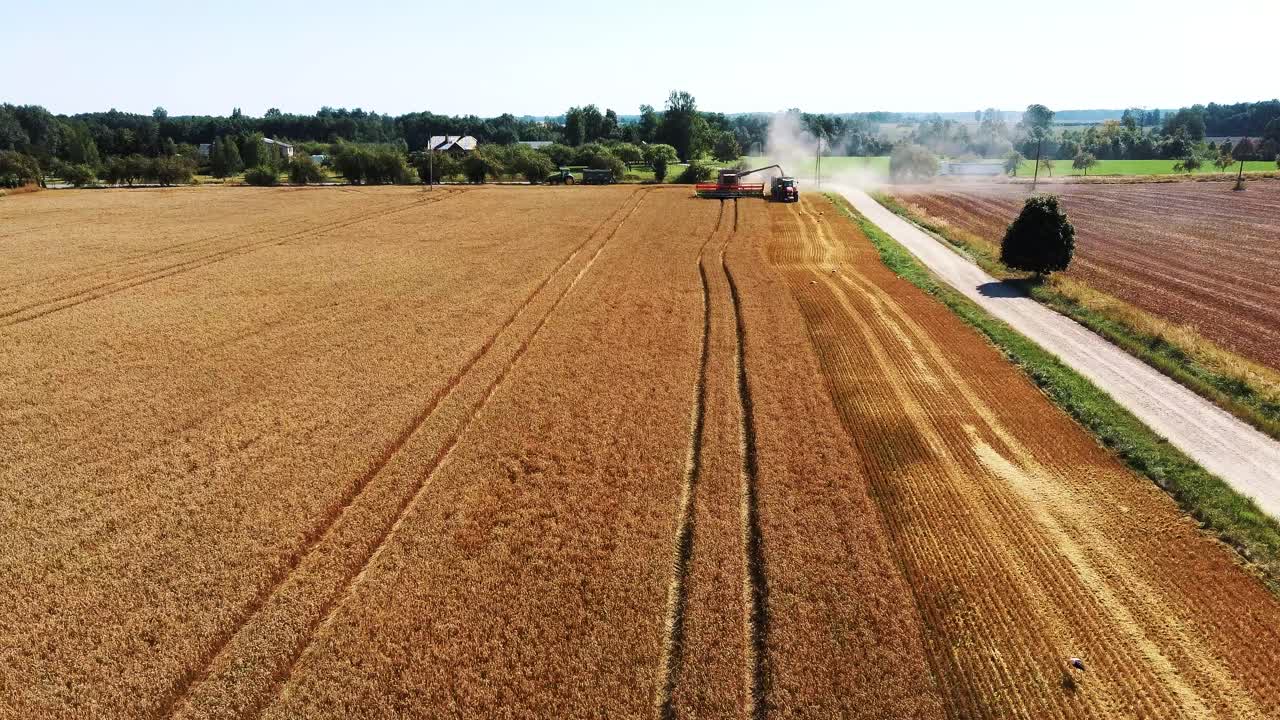 Aerial Shot of Combine Loading Off Corn Grains Into Tractor Trailer-5