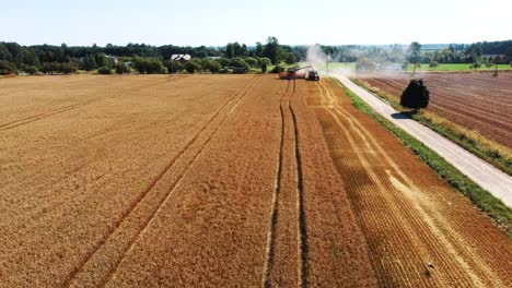 aerial shot of combine loading off corn grains into tractor trailer-5