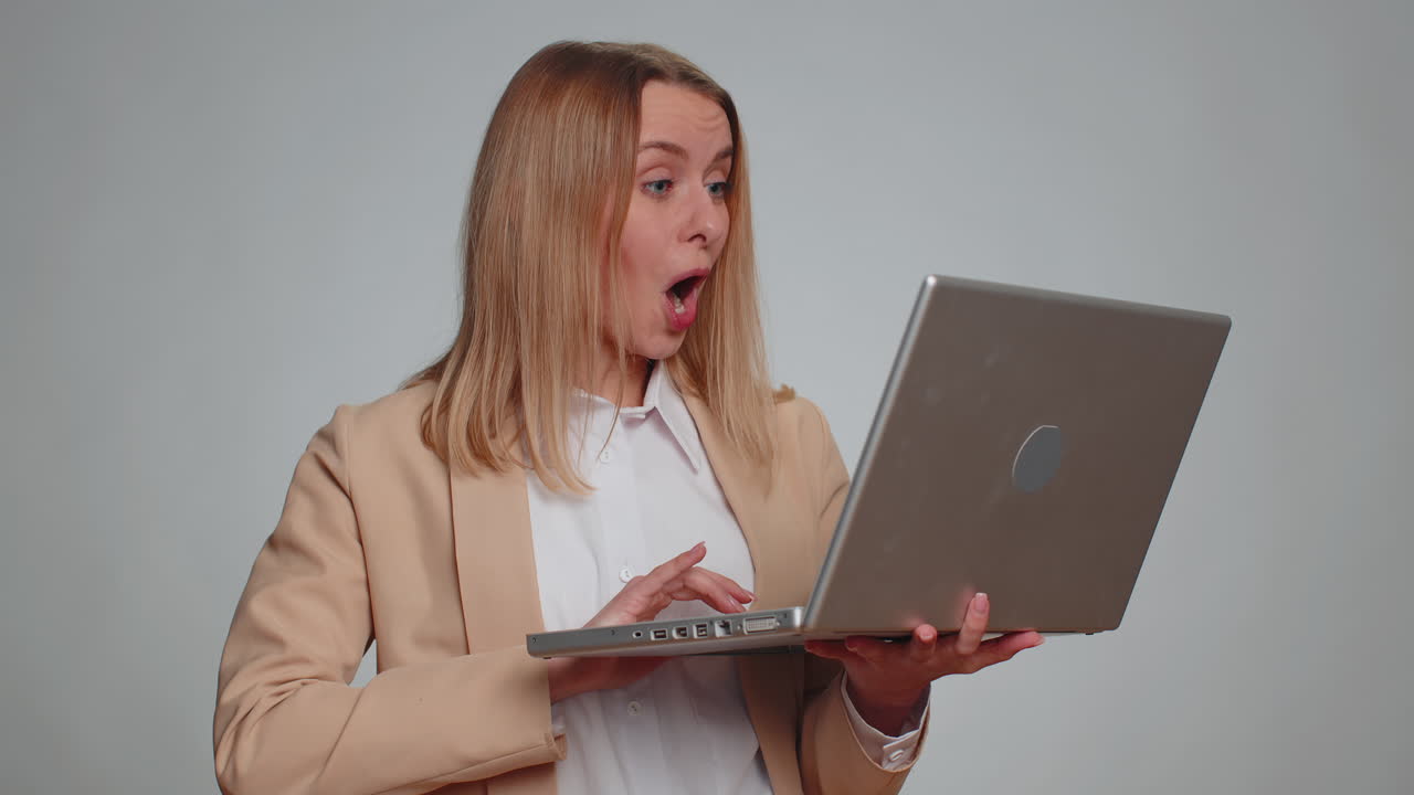 Excited happy business woman work on laptop project enjoying results winning lottery celebrate