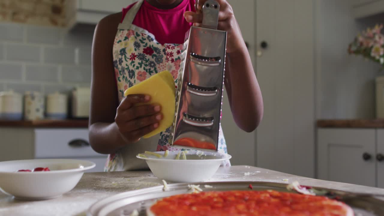 Girl cleaning grater with sponge on bell icon popping and icons rising around food content