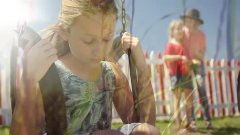 a girl on a swing and another girl with her mother