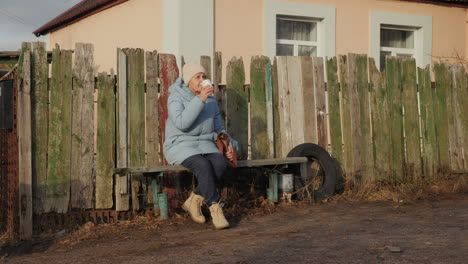 senior woman drinking coffee outdoors