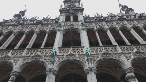close-up of decorative arches and statues on brussels city museum, grand place, belgium